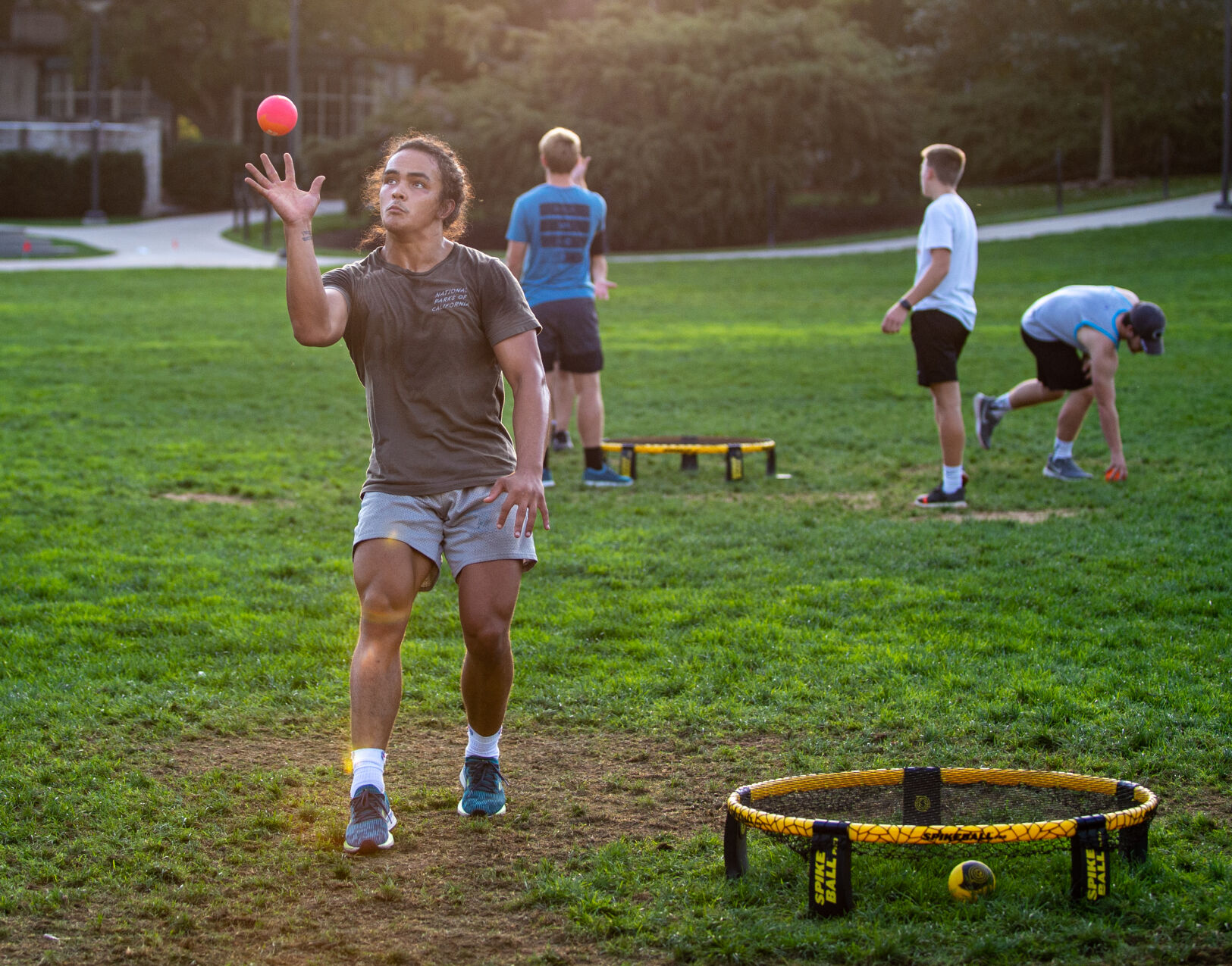 John Halbrendt serves spikeball on HUB lawn